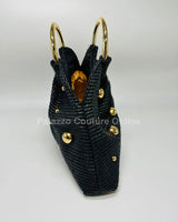 Soft black woven handbag with circular top handle design