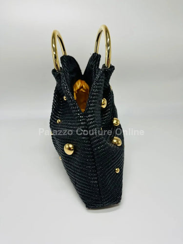 Soft black woven handbag with circular top handle design