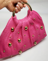 Side view of soft woven tote bag fuchsia – relaxed shape and handle detail
