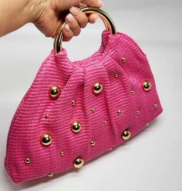Side view of soft woven tote bag fuchsia – relaxed shape and handle detail