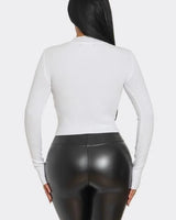 White Heart Cutout Turtleneck Top – Lovely Fit showing sleeve construction and neckline detail