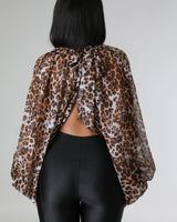 animal print chiffon blouse flat lay