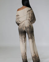 One-piece wide leg jumpsuit with flowing silhouette