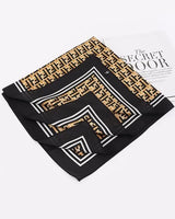 women's silk bandana scarf with bold monogram pattern