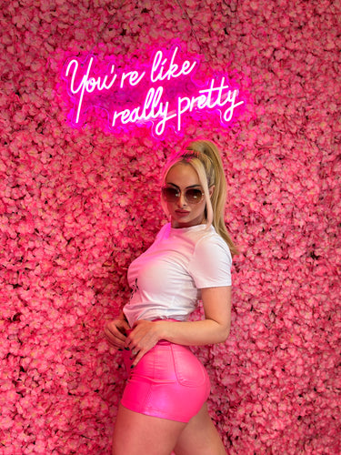 Hot pink shimmer shorts designed for a stylish and bold summer look.