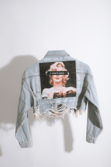 Light-wash denim jacket with bold graffiti back print