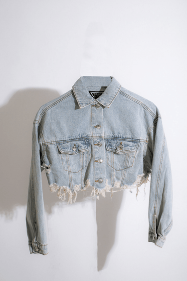 Cropped denim jacket in distressed light blue finish