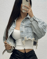 Distressed black denim jacket with graphic of Marylin Monroe